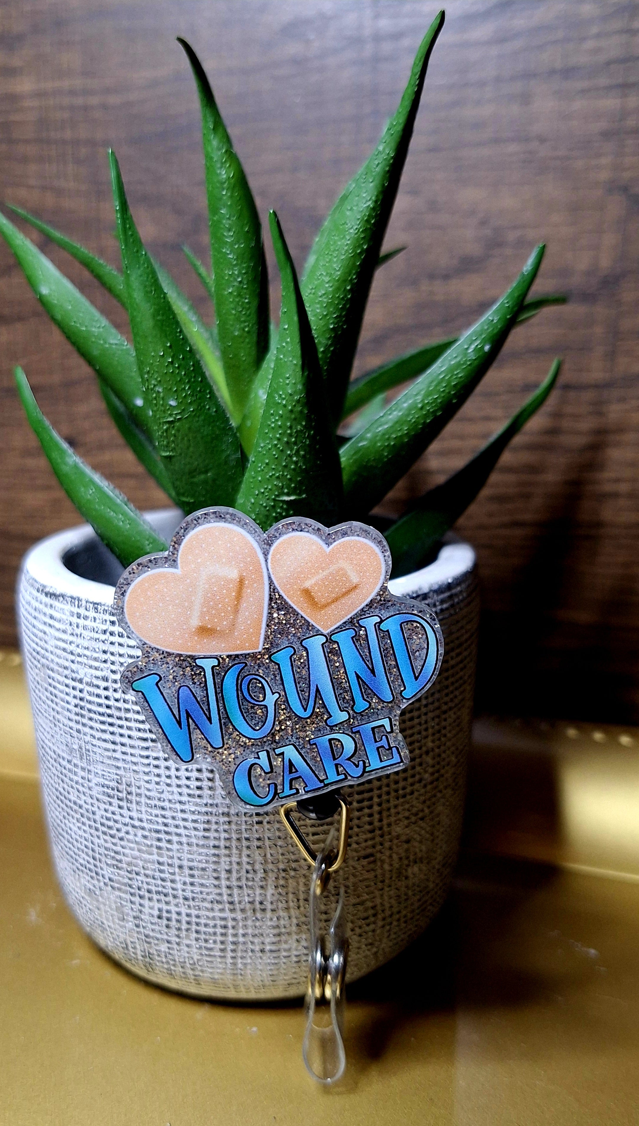 Woune Care (Badge reel)