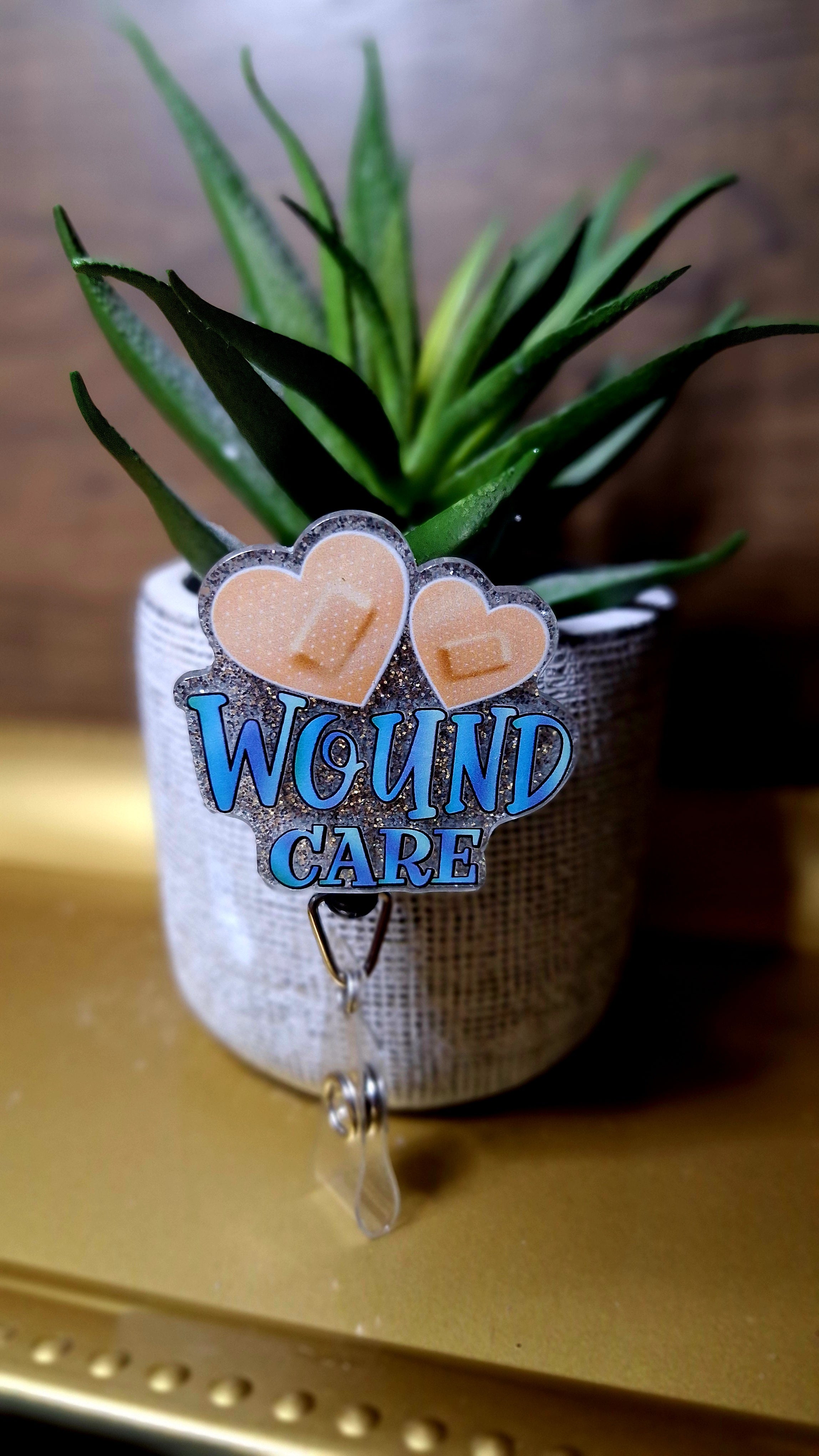 Woune Care (Badge reel)