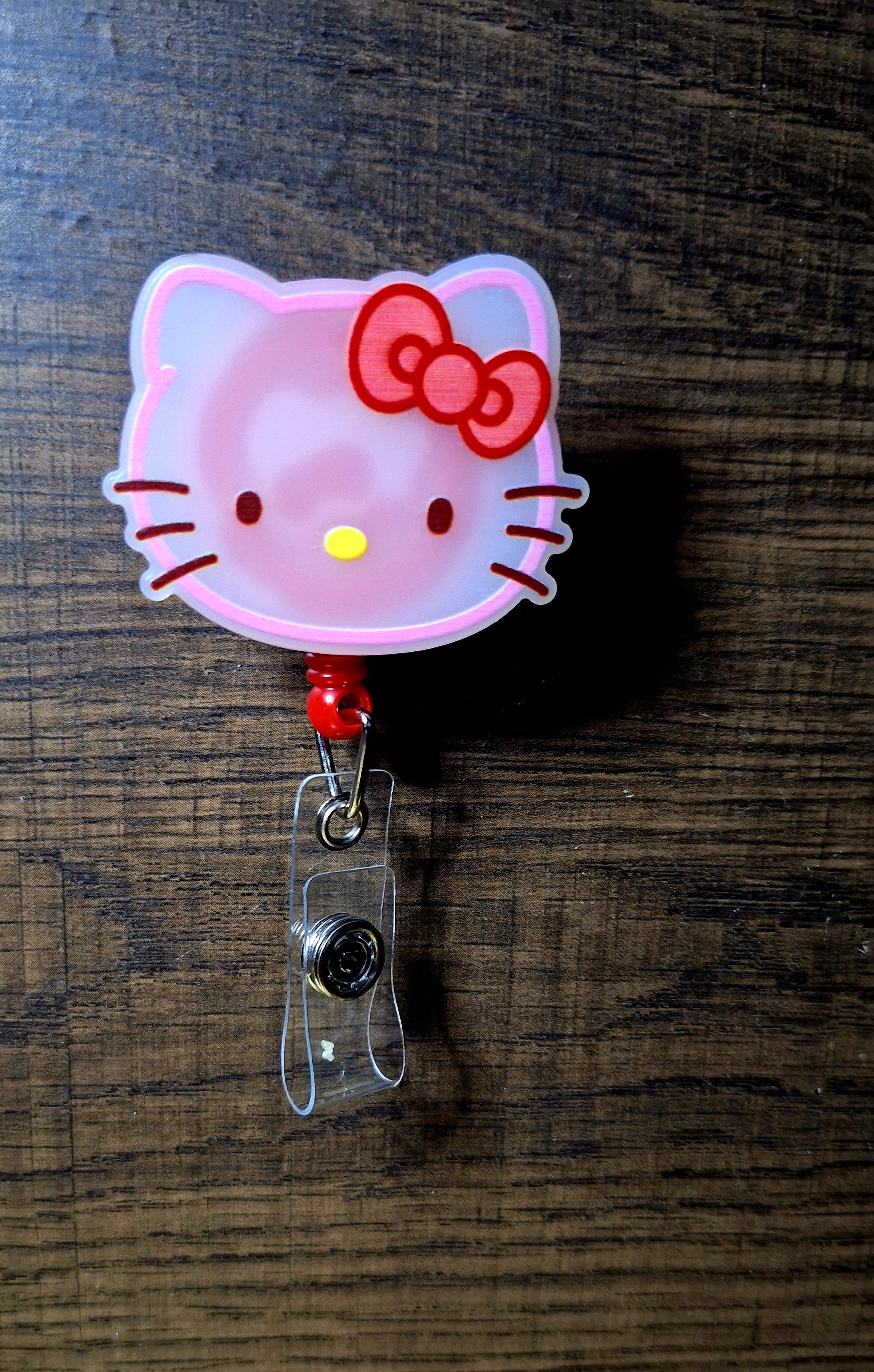 Hello Kitty (Badge Reel)