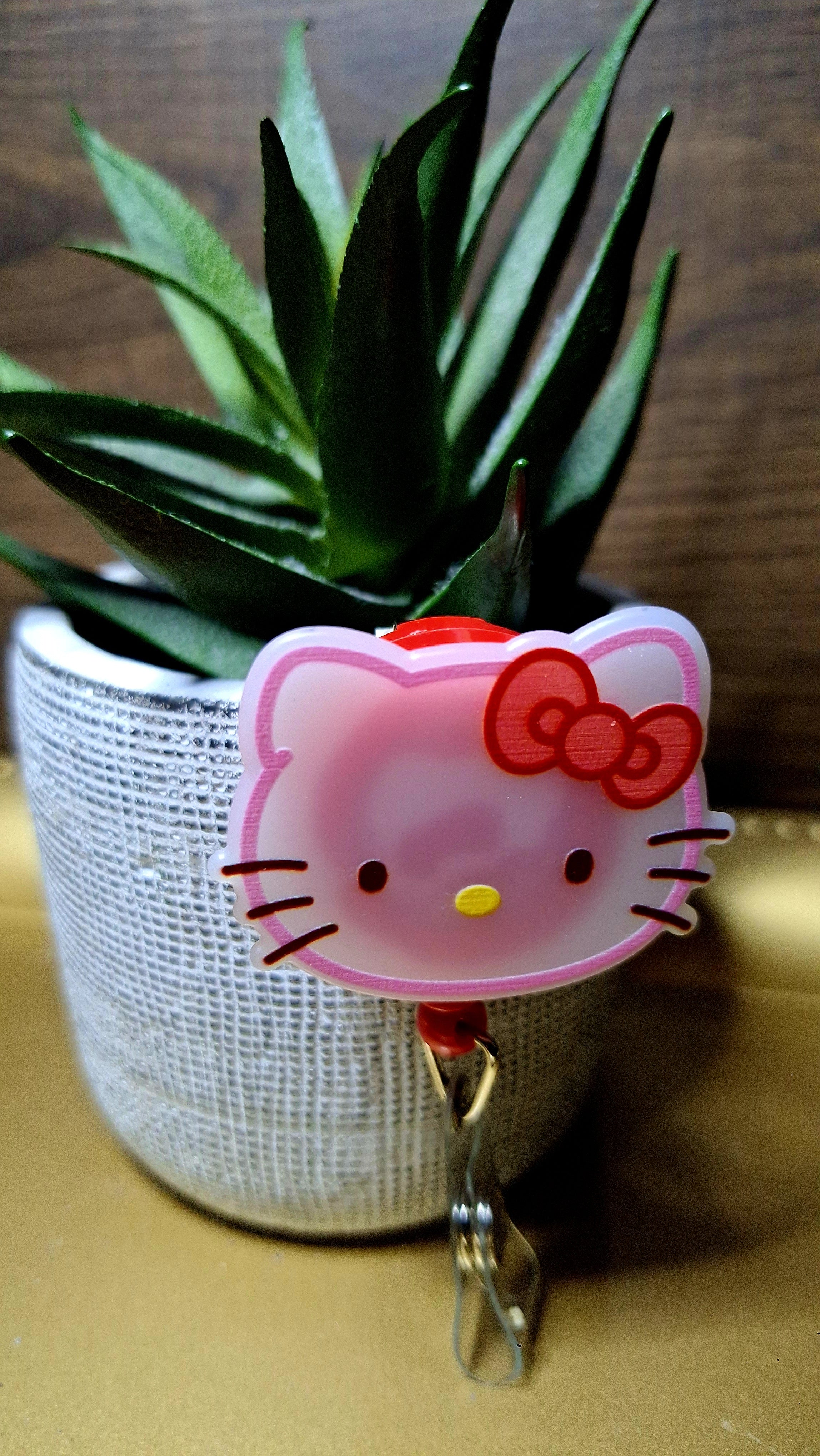 Hello Kitty (Badge Reel)