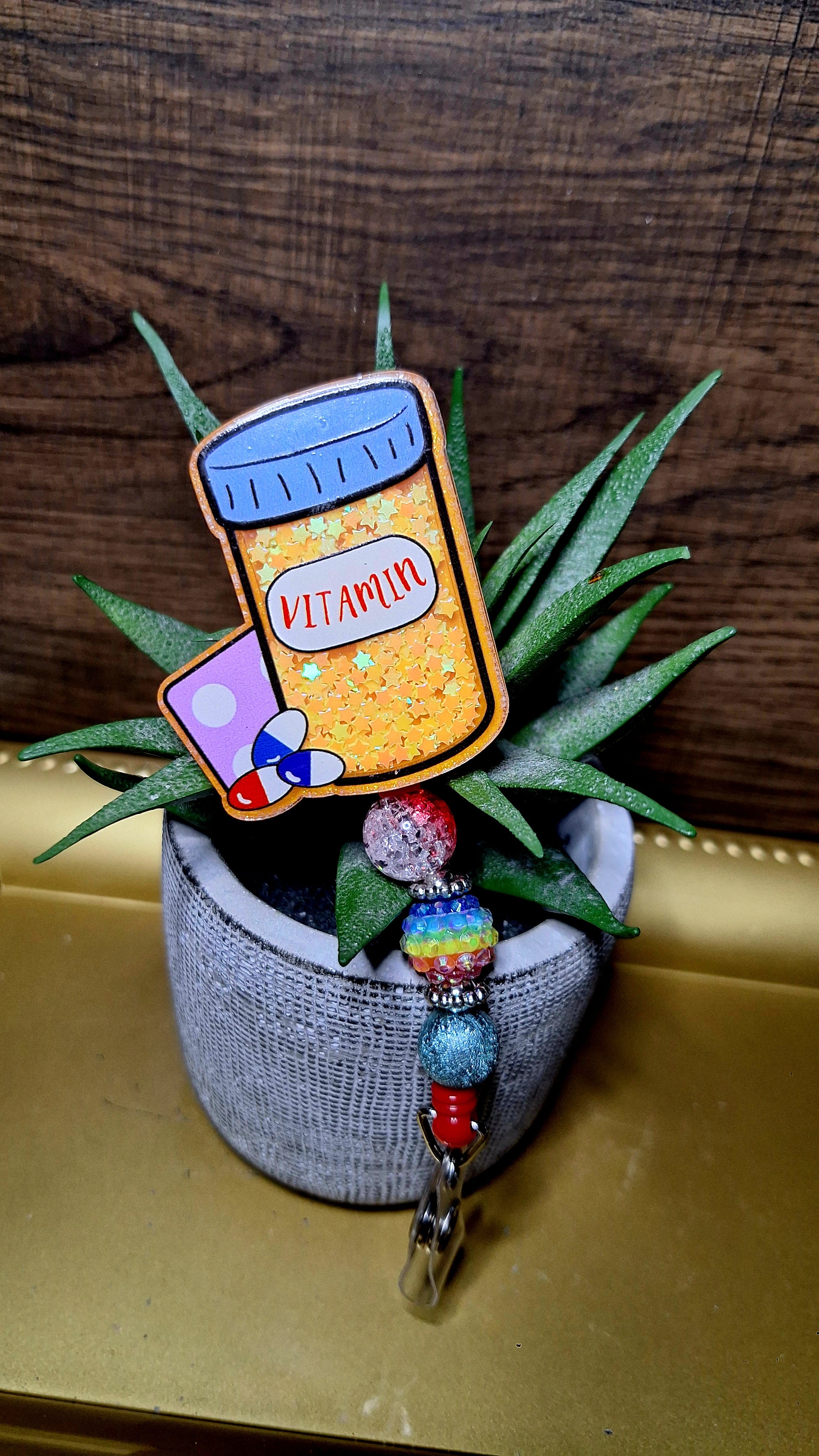 Vitamin Check (Shaker) (Badge Reel)