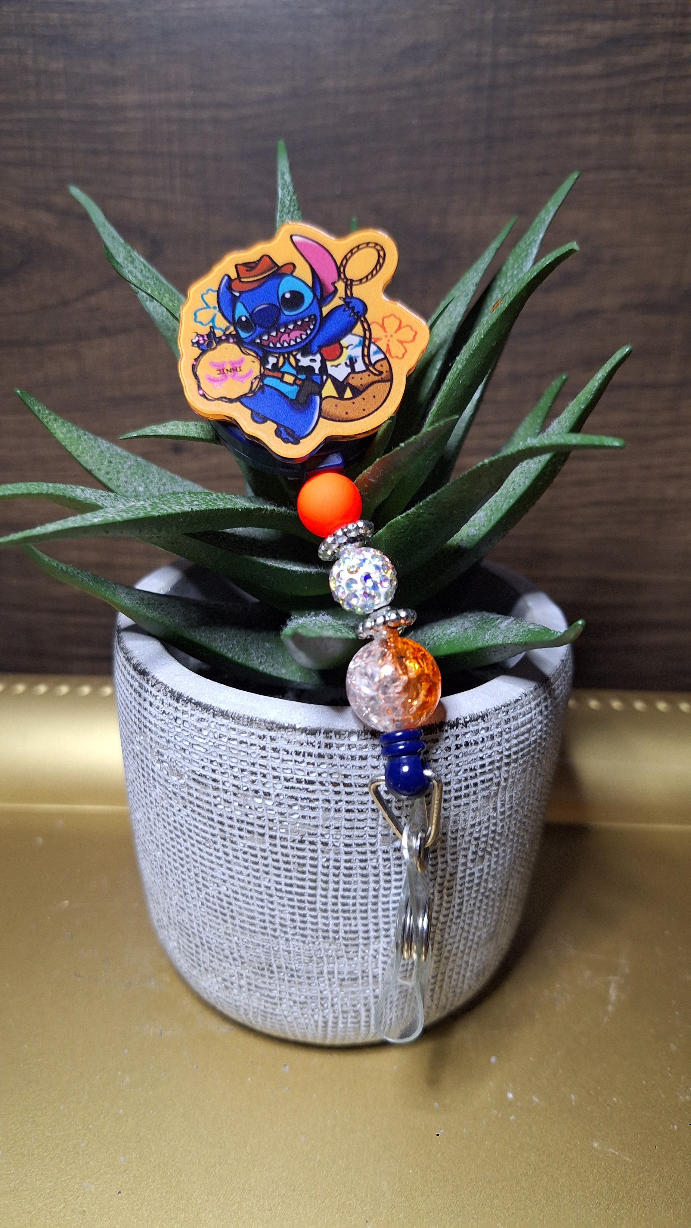 Rodeo Stitch (Orange) (Badge Reel)
