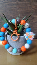 Over Stimulated Moms Club (Wristlet Keychain)